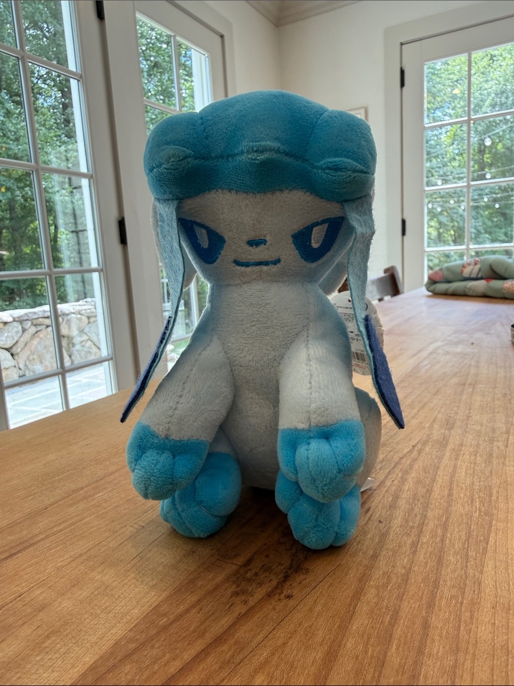 Glaceon Pokémon sitting stuffed toy
